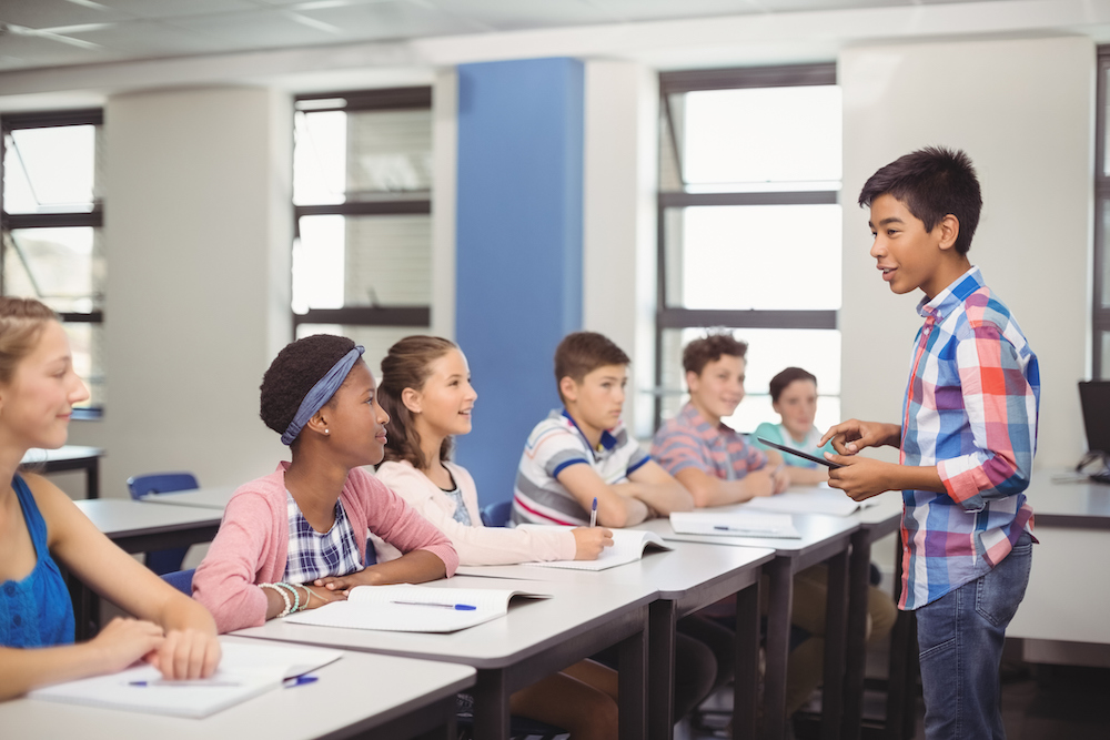 student speaking in class