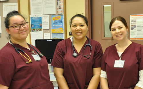 three nursing students smiling