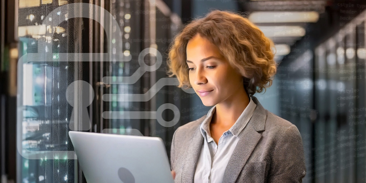 woman in business suit working at a computer.