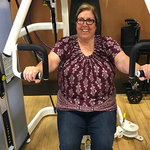 Nancy Minton working out in the APE gymnasium