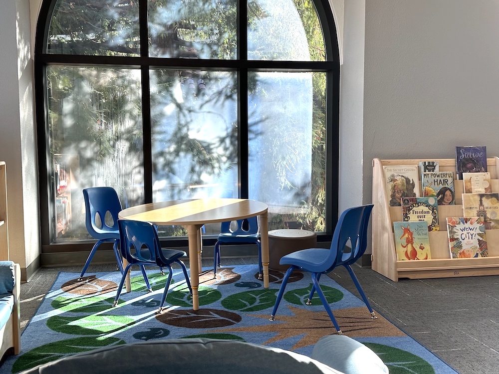 table and chairs by sunny window