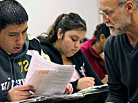 Faculty member and students in class.