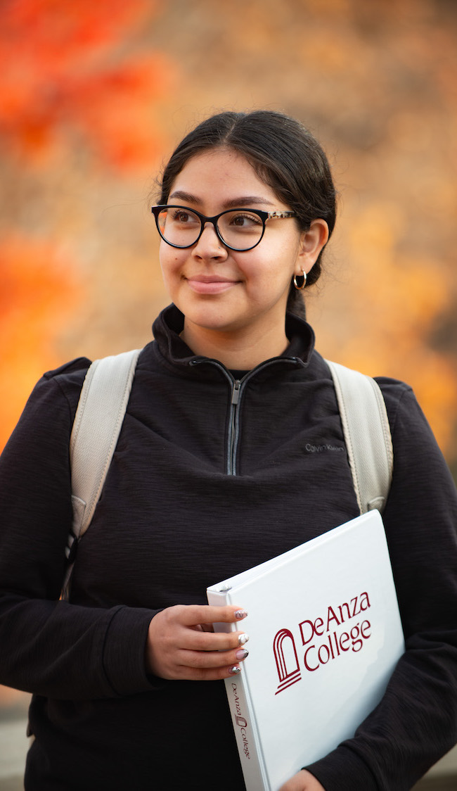 young woman with De Anza binder