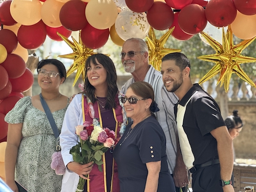 nursing student with family and balloons