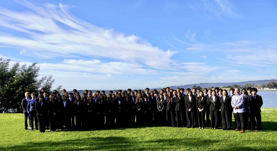 Students in suits posing together at the Future Business Leaders of America State Business Leadership Conference