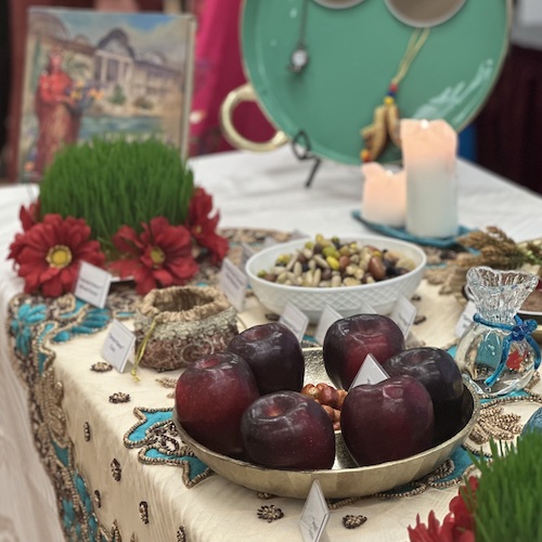 table with bowl of fruit and other foods